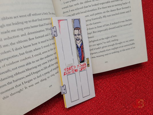 The classic horror magnetic bookmark rests against an open book. Each bookmark stands at 5.5 inches tall.