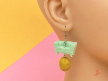 Close-up shot of of the Couch Potato earrings being worn on a mannequin.