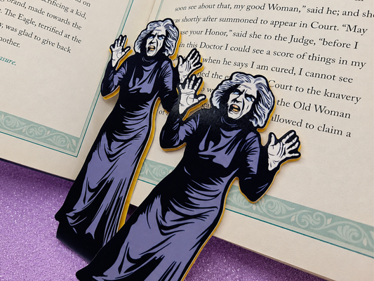 Close-up shots of magnetic bookmarks featuring original art of the creepy old woman from the classic horror movie House on Haunted Hill. The spooky vintage movie art is printed on high-quality coverstock.