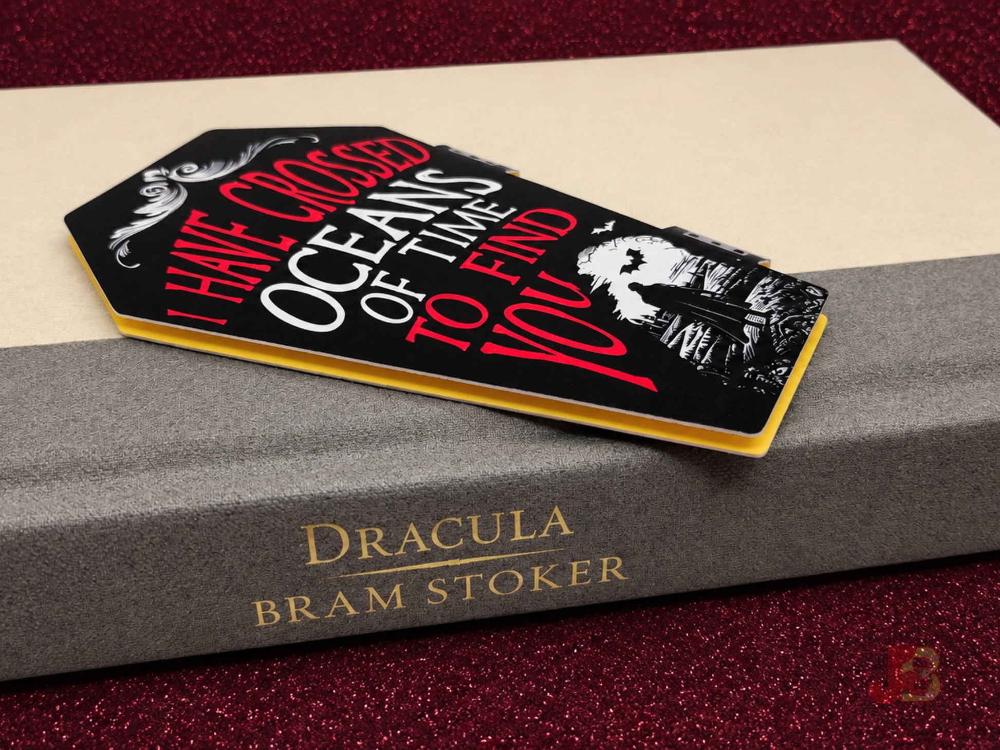 Oceans of Time Dracula inspired magnetic bookmark laying on a book.