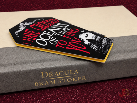 Oceans of Time Dracula inspired magnetic bookmark laying on a book.