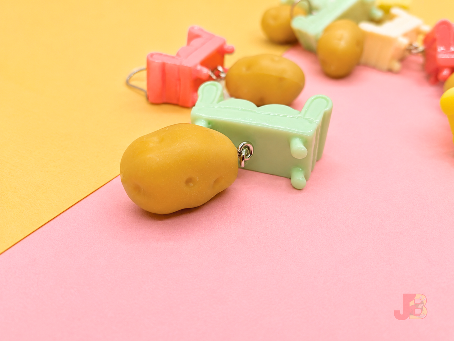 Detailed view of the potato charm dangling from the couch.