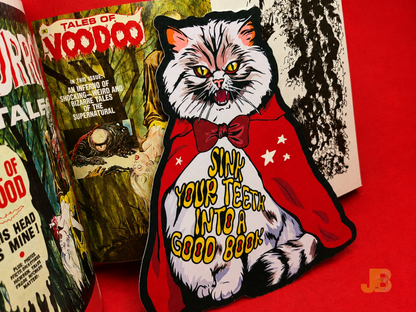 Up-close shot of a Pallas cat vampire die-cut bookmark, 6 inches tall and double-sided. Printed on high-quality, luxurious cotton coverstock.