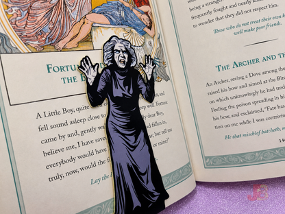Back of the magnetic bookmark featuring original art of the creepy old woman from the classic horror movie House on Haunted Hill. Each bookmark stands at 5 inches tall.
