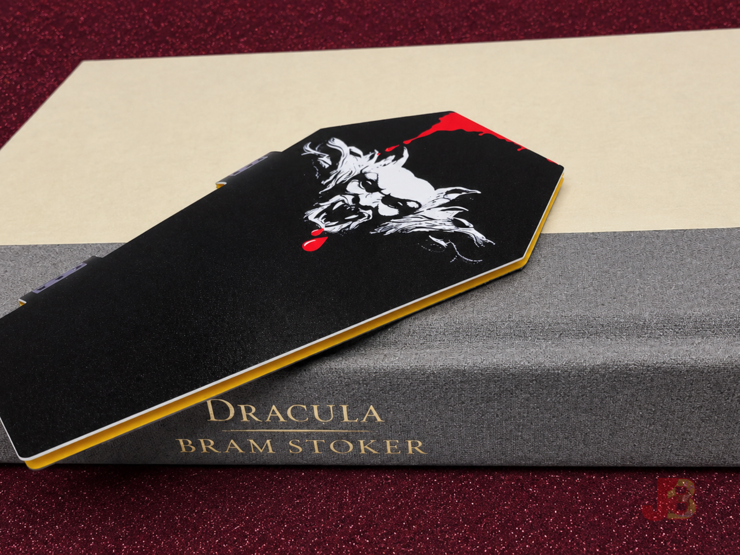 Back of the coffin-shaped magnetic bookmark featuring a gargoyle illustration.