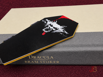 Back of the coffin-shaped magnetic bookmark featuring a gargoyle illustration.