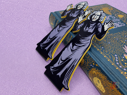 Close-up shots of magnetic bookmarks featuring original art of the creepy old woman from the classic horror movie House on Haunted Hill. The spooky vintage movie art is printed on high-quality coverstock.