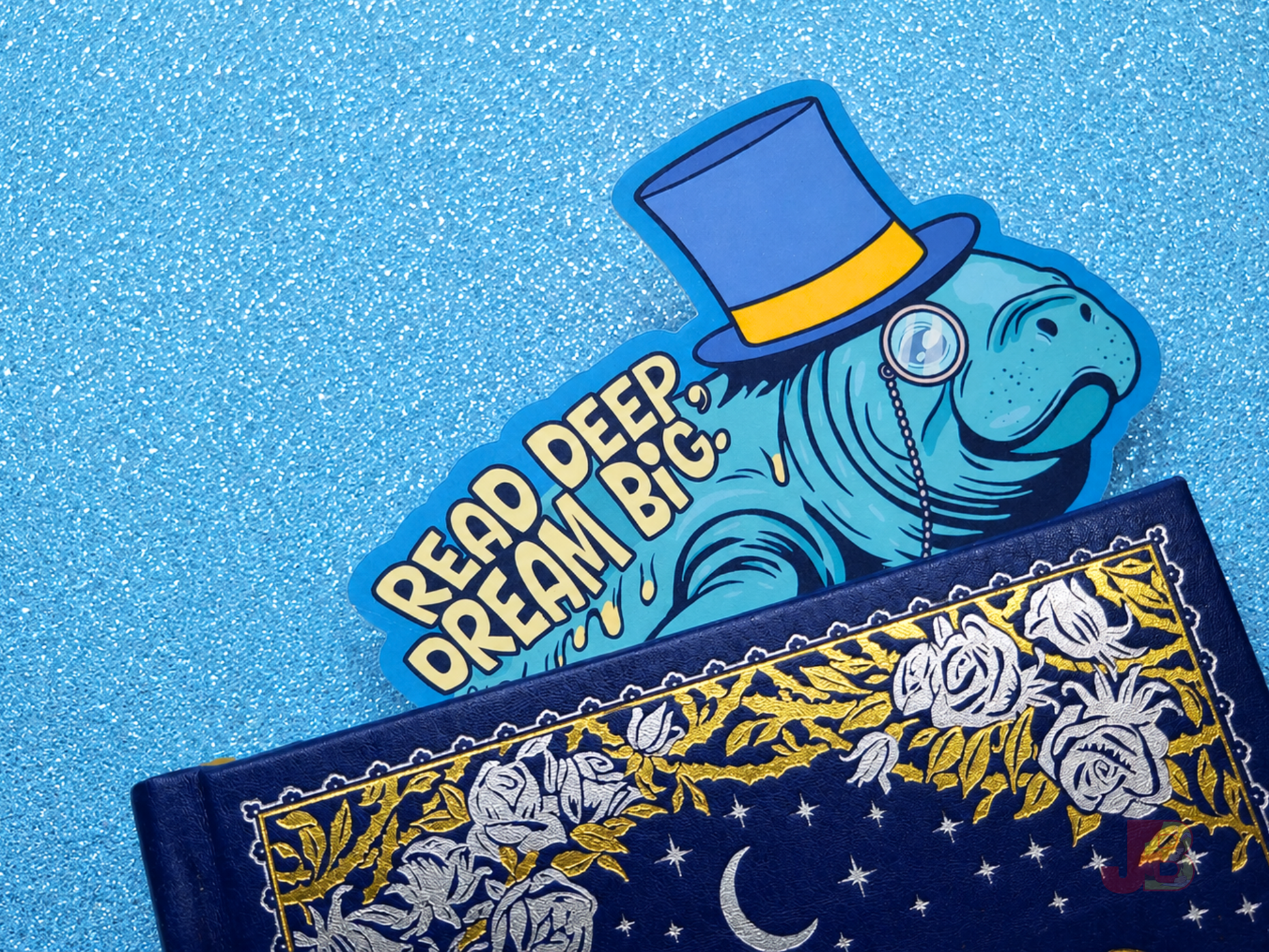 A cute ocean-themed accessory. The manatee bookmark is popping out the pages at the top of a hardcover novel and is double-sided and printed on premium cotton coverstock. It is the perfect gift for book lovers and marine biology fans.