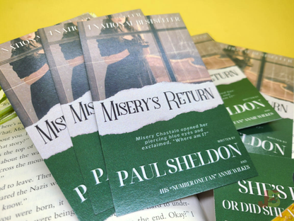 Stack of novel bookmarks titled 'Misery's Return' by Paul Sheldon on a yellow background
